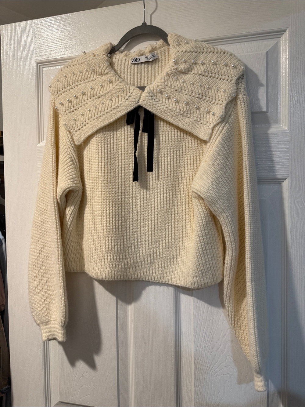 Zara Cream Knit Sweater with Pearl-Embellished Collar and Black Ribbon